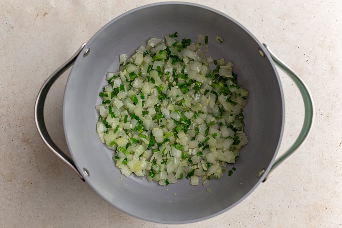 onions and green onion in a large pot to make lentil soup