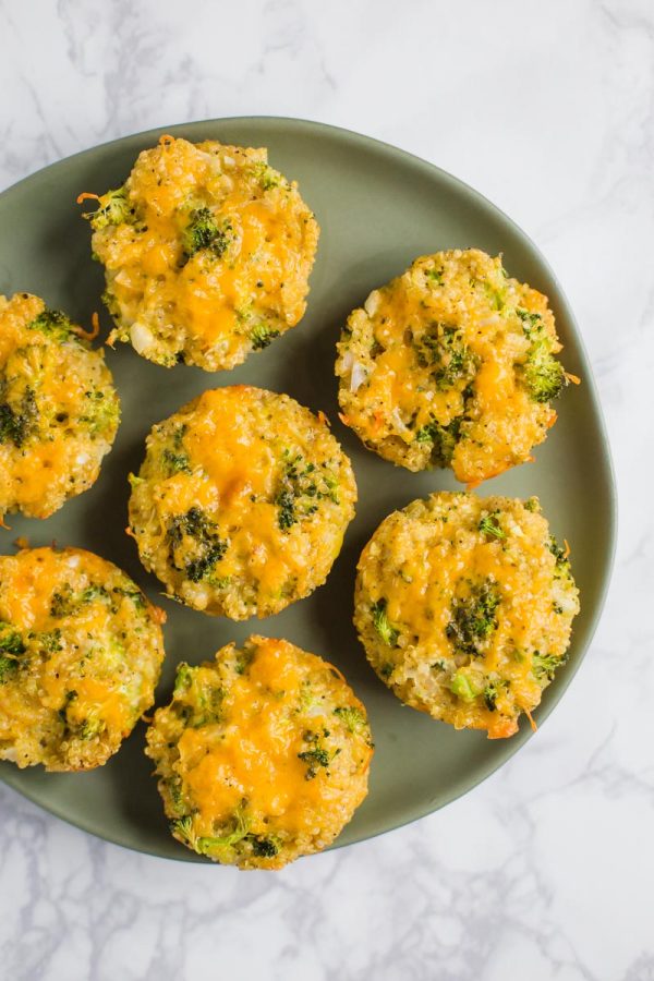 quinoa, cheddar cheese, and broccoli bites on a marble board