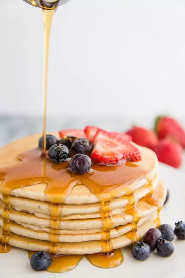 Easy Vegan Pancakes Recipe can be whipped together in just 10 minutes and makes for the perfect vegan breakfast! They freeze well which makes them perfect for meal prep.