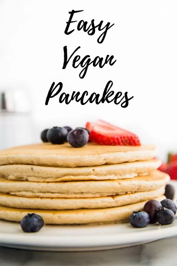 Easy Vegan Pancakes Recipe can be whipped together in just 10 minutes and makes for the perfect vegan breakfast! They freeze well which makes them perfect for meal prep.
