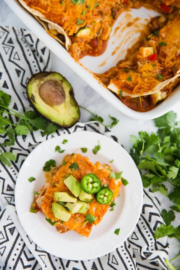 This Loaded Veggie Enchilada Casserole Recipe is a delicious take on traditional enchiladas. An easy dinner that is vegetarian and can even be made into a vegan enchilada casserole if you just leave off the cheese!