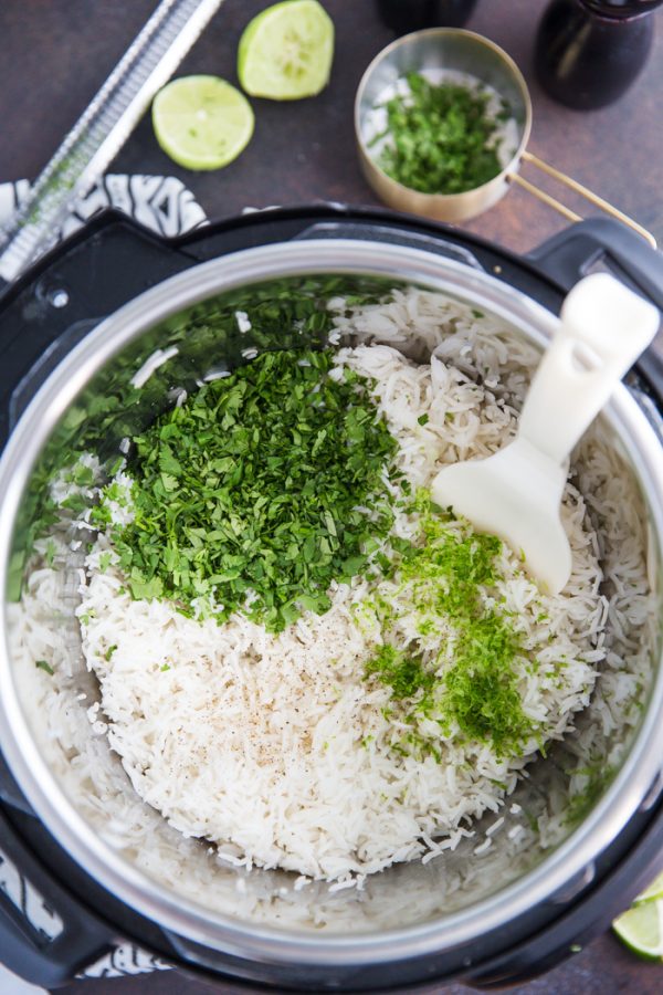 Instant Pot Cilantro Lime Rice- this simple recipe shows you how to make fluffy and delicious cilantro lime rice directly in your pressure cooker.