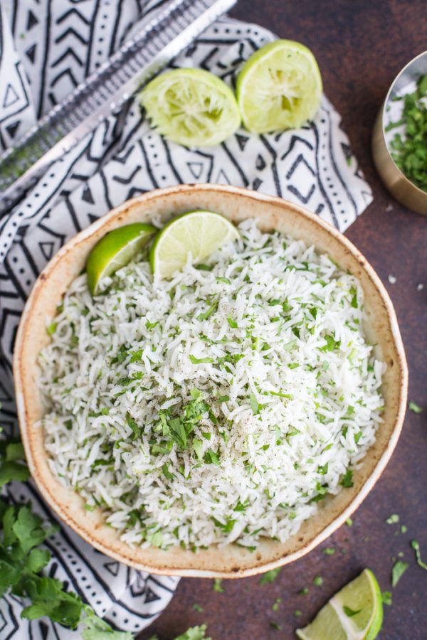 Instant Pot Cilantro Lime Rice- this simple recipe shows you how to make fluffy and delicious cilantro lime rice directly in your pressure cooker.