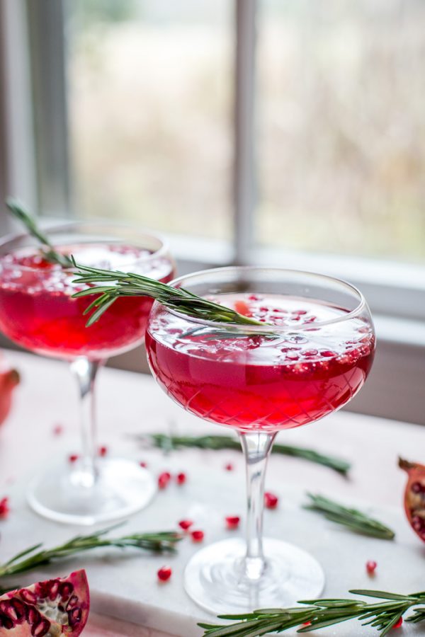 Pomegranate Champagne Cocktail- this holiday cocktail is easy to make in either a single glass or a pitcher to serve a crowd!