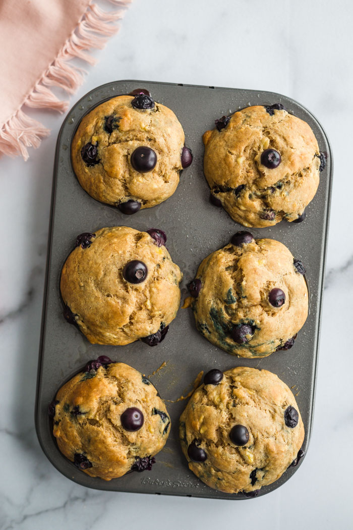 6 blueberry muffins on a marble board