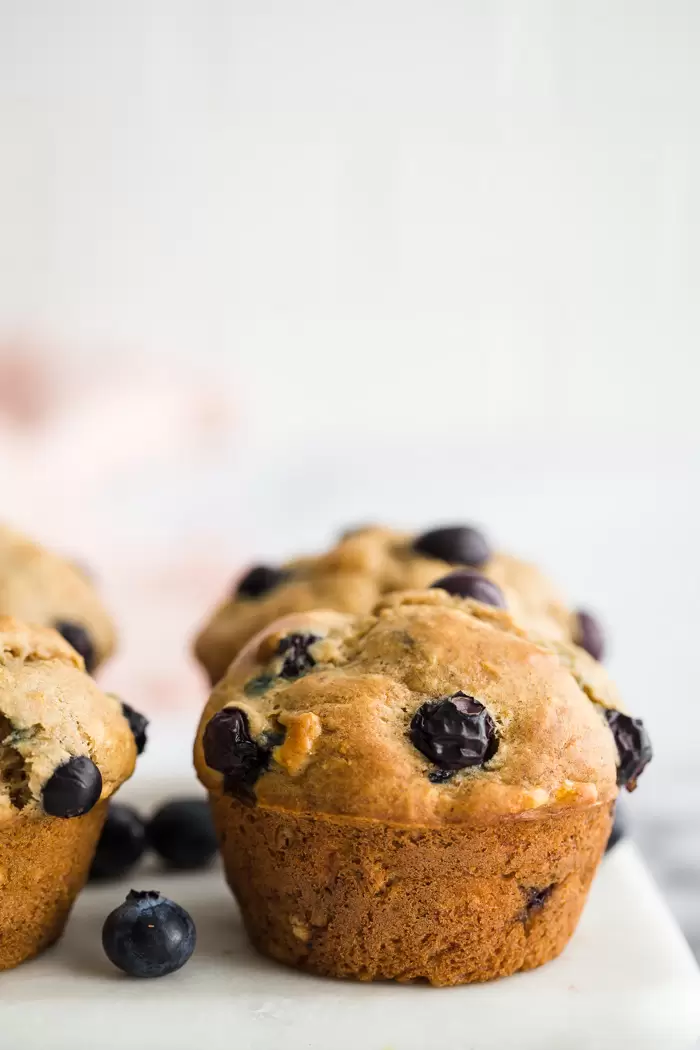 blueberry muffins on a marble board