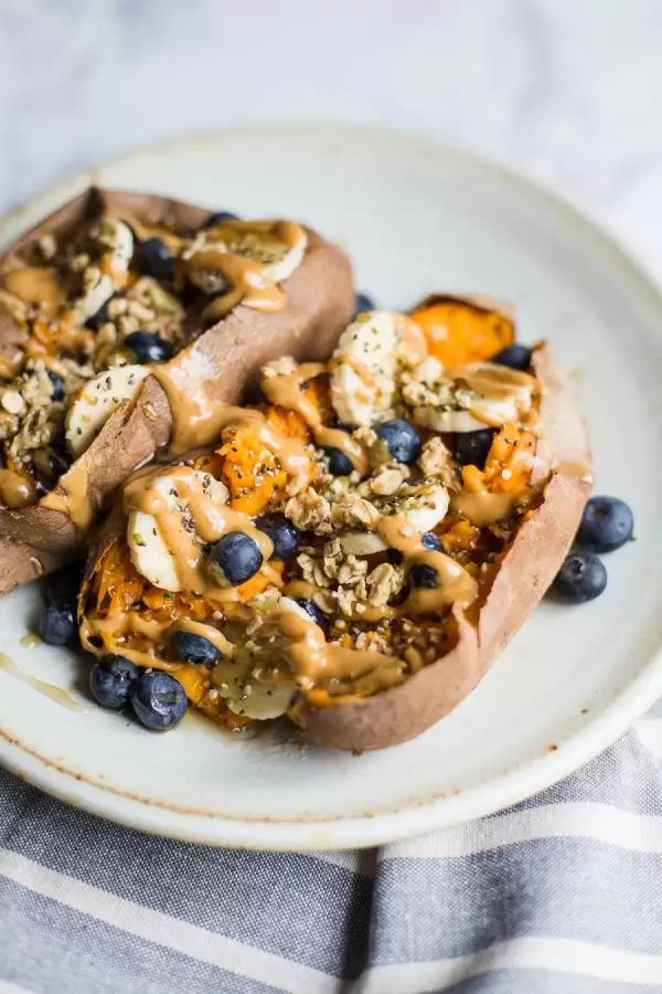 sweet potato loaded with banana, blueberries, granola, and a drizzle of peanut butter