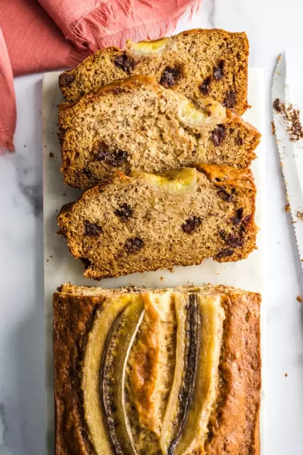 chocolate chip banana bread on a marble board