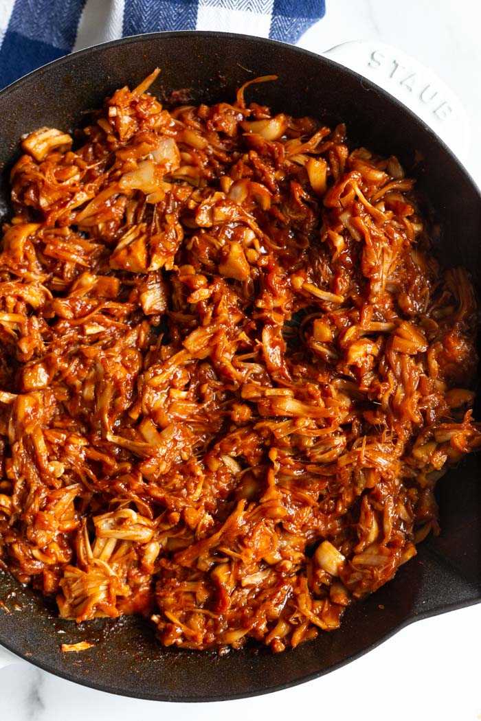 jackfruit pulled pork in a cast iron skillet and covered in bbq sauce