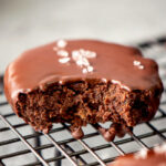 vegan dessert brownie covered in melted chocolate and a sprinkle of sea salt