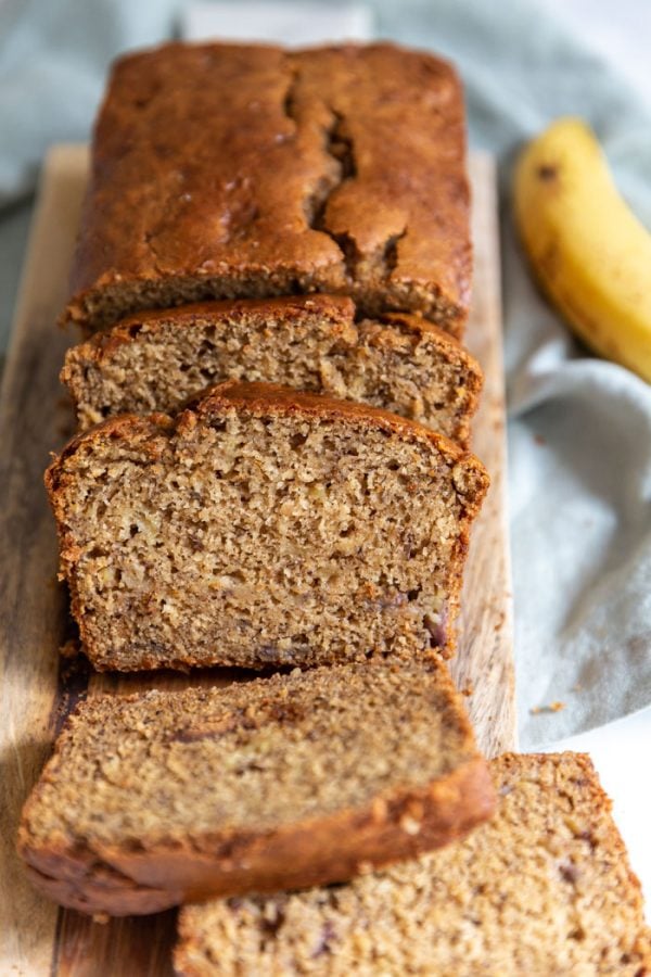 Vegan Banana bread slices on a wood board