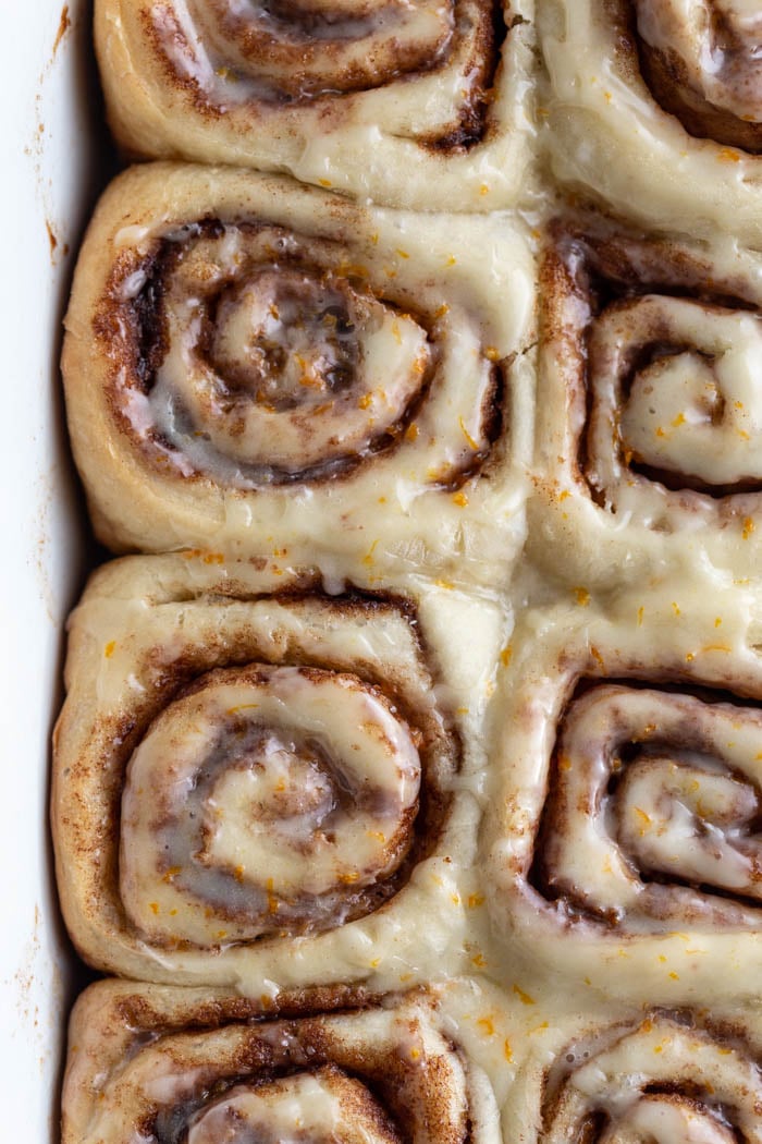 close up shot of cinnamon rolls in a casserole dish