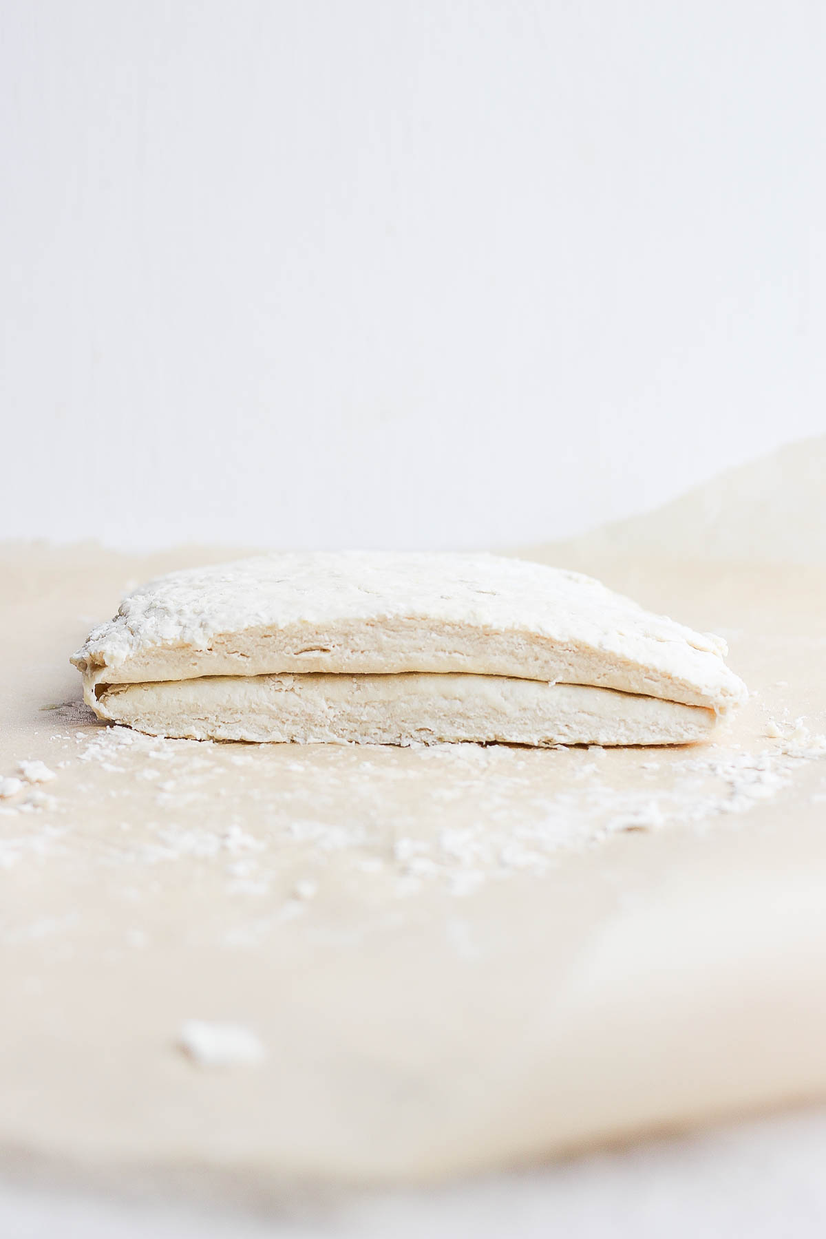 biscuit dough that's been cut in half and stacked on top of itself