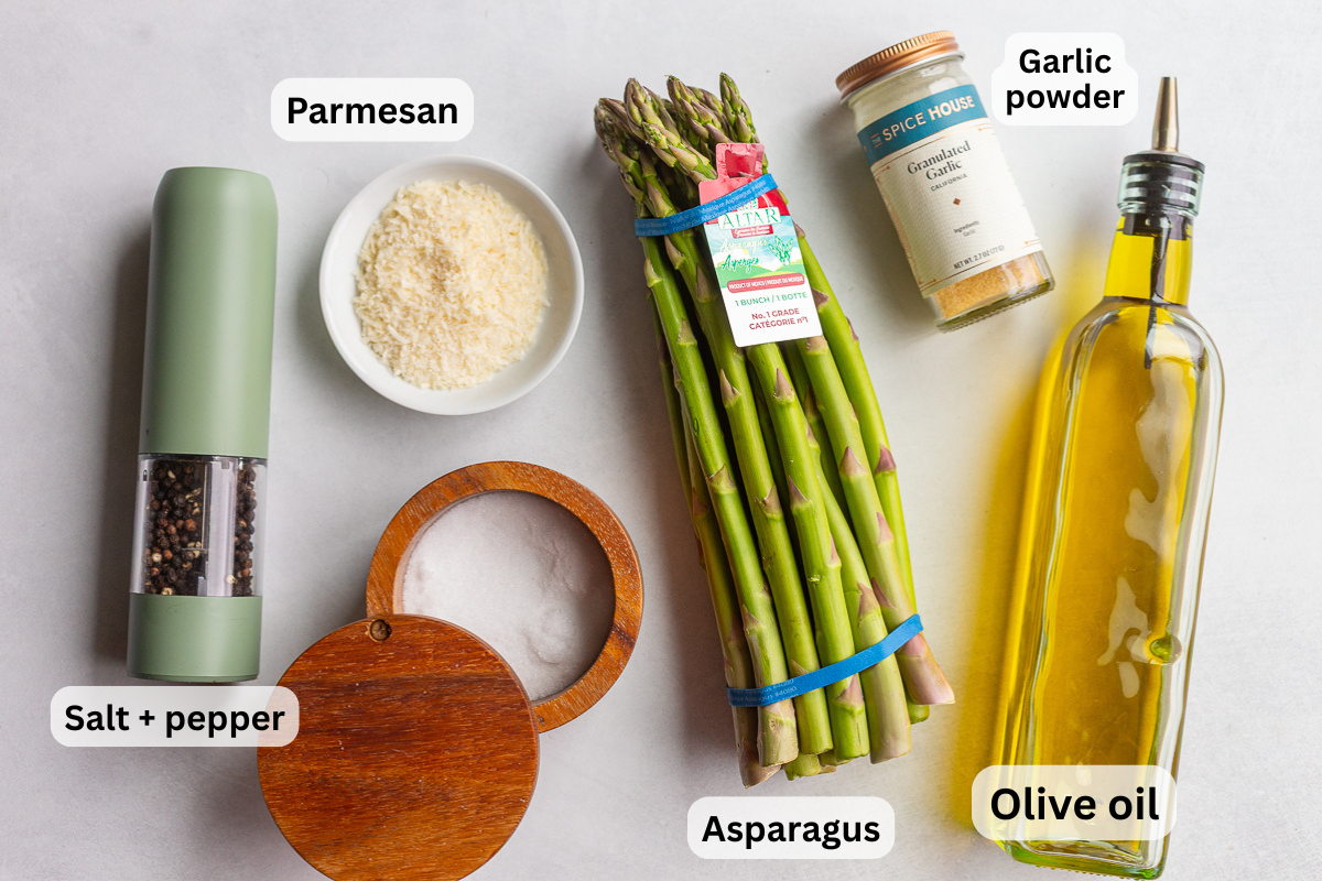 ingredients needed to make parmesan asparagus including olive oil, salt, pepper, asparagus, and parmesan