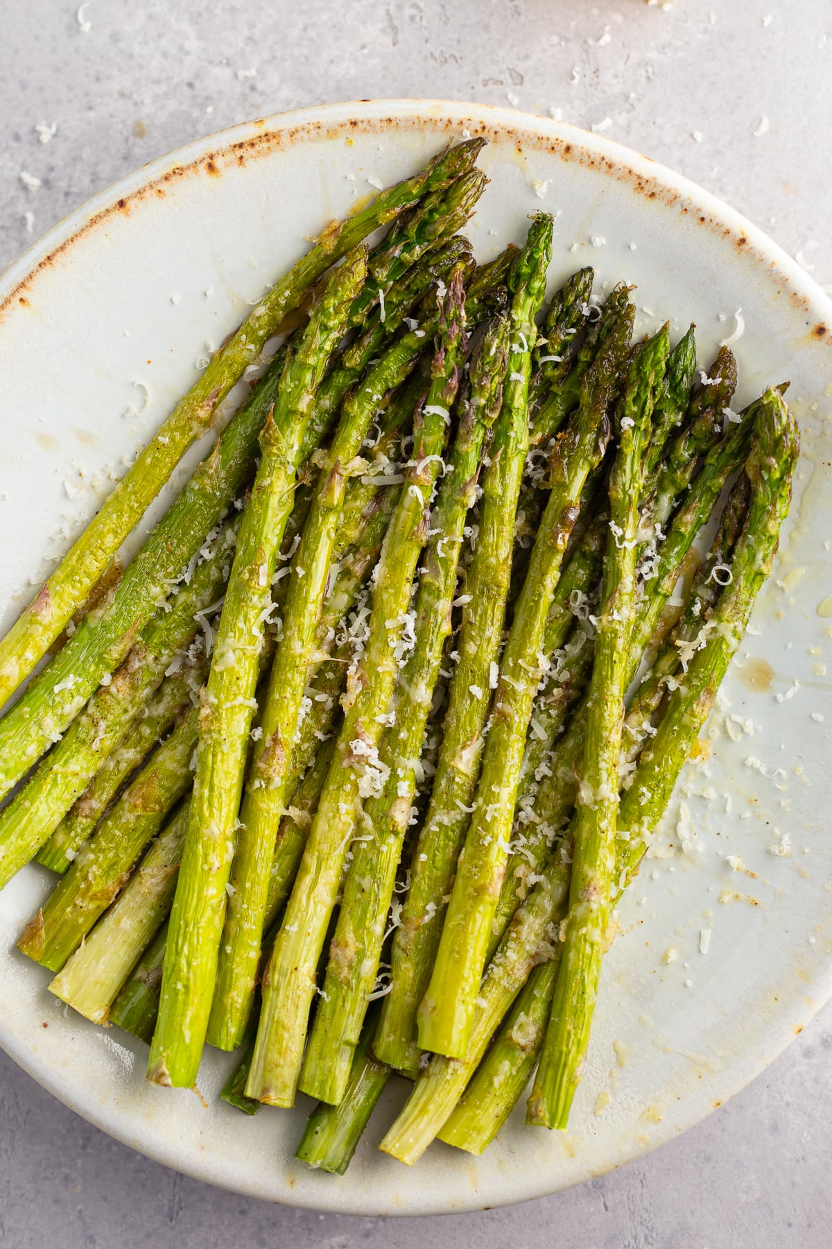 roasted asparagus topped with melted parmesan
