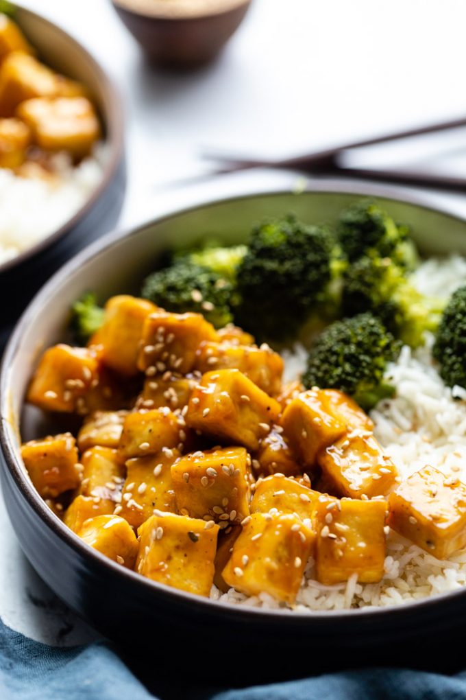 sesame tofu bowls served with broccoli and rice