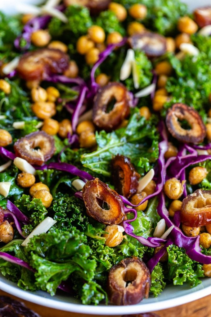 date kale salad with purple cabbage, chickpeas, and almonds