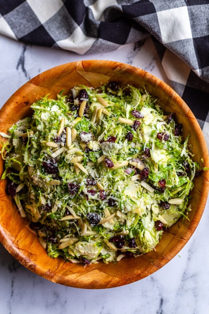 shredded brussel sprouts salad in a large serving bowl