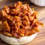 bbq jackfruit on the bottom half of a bun
