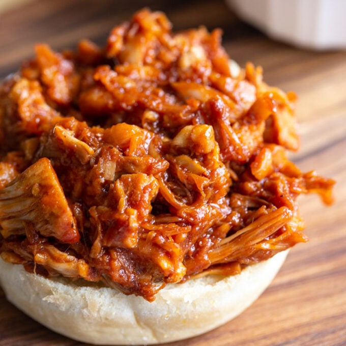 bbq jackfruit on the bottom half of a bun