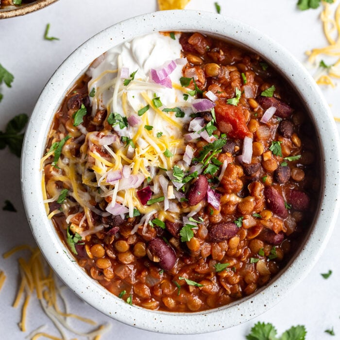 lentil chili topped with sour cream and cheese