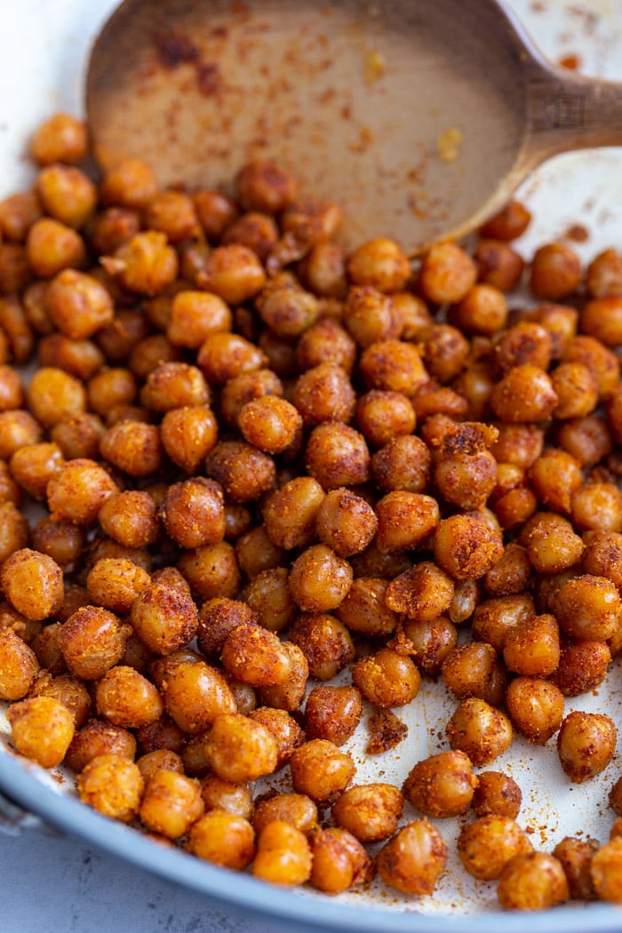 spiced crispy chickpeas in a white skillet