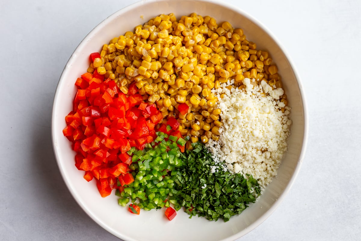 ingredients for street corn salad in a bowl