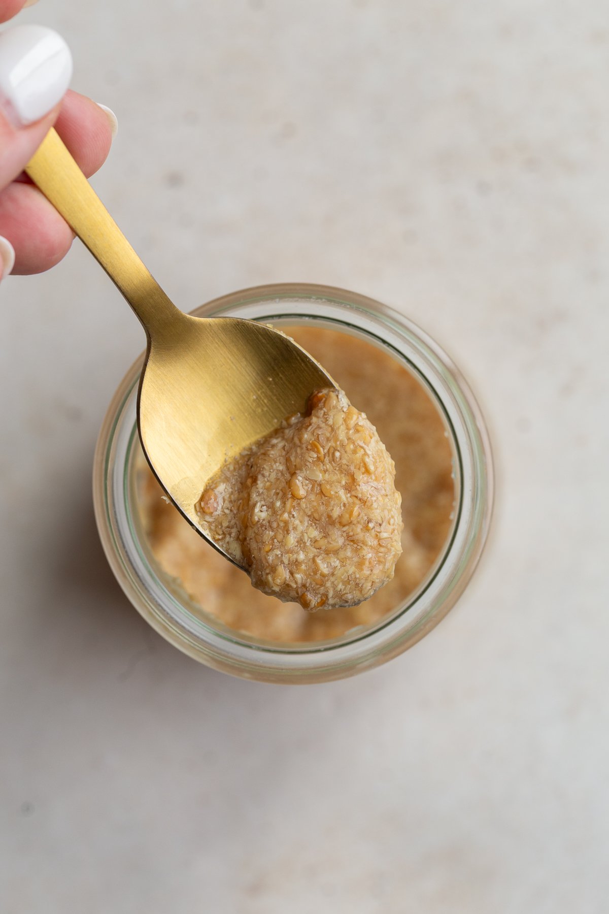 Flax egg on a spoon.