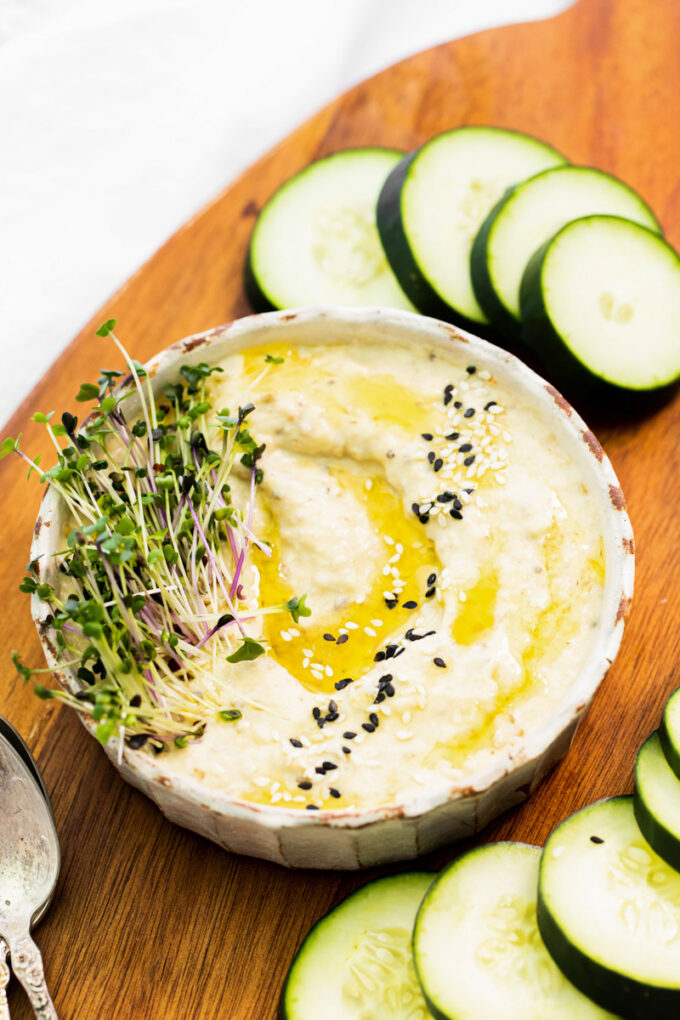 dip drizzled with olive oil and garnished with fresh spouts
