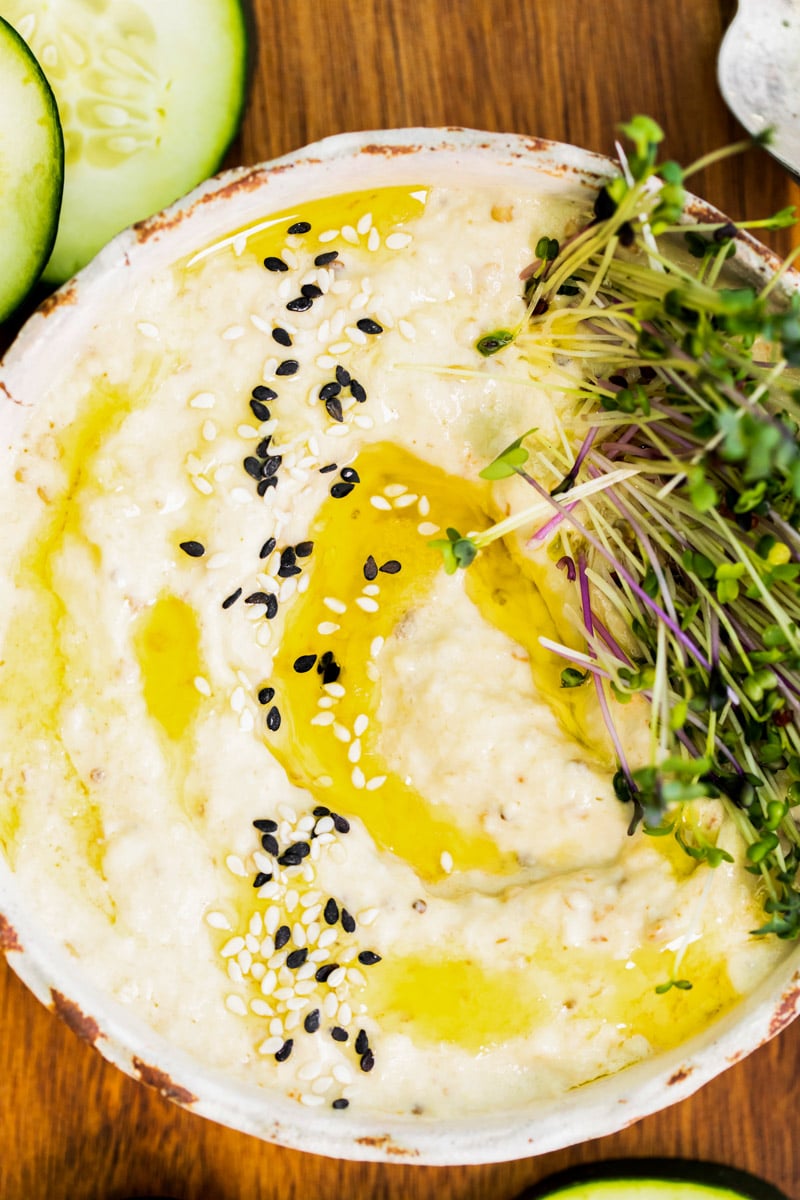 Baba Ganoush dip topped with a drizzle of olive oil and sesame seeds