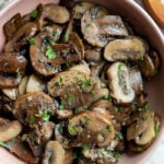sautéed baby Bella mushrooms served in a small bowl
