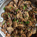 mushrooms sautéing in a large skillet