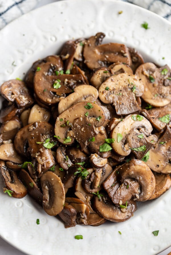 sautéed mushrooms served in a white bowl