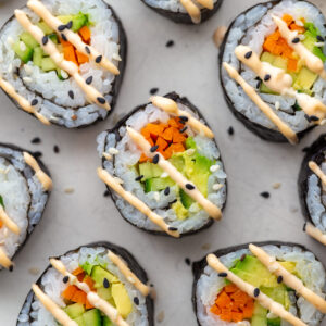 Cucumber rolls drizzled with spicy mayo.