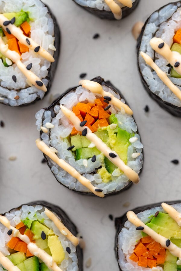 Cucumber rolls drizzled with spicy mayo.