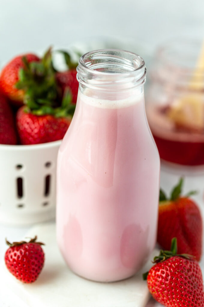 glass jar filled with fresh strawberry milk