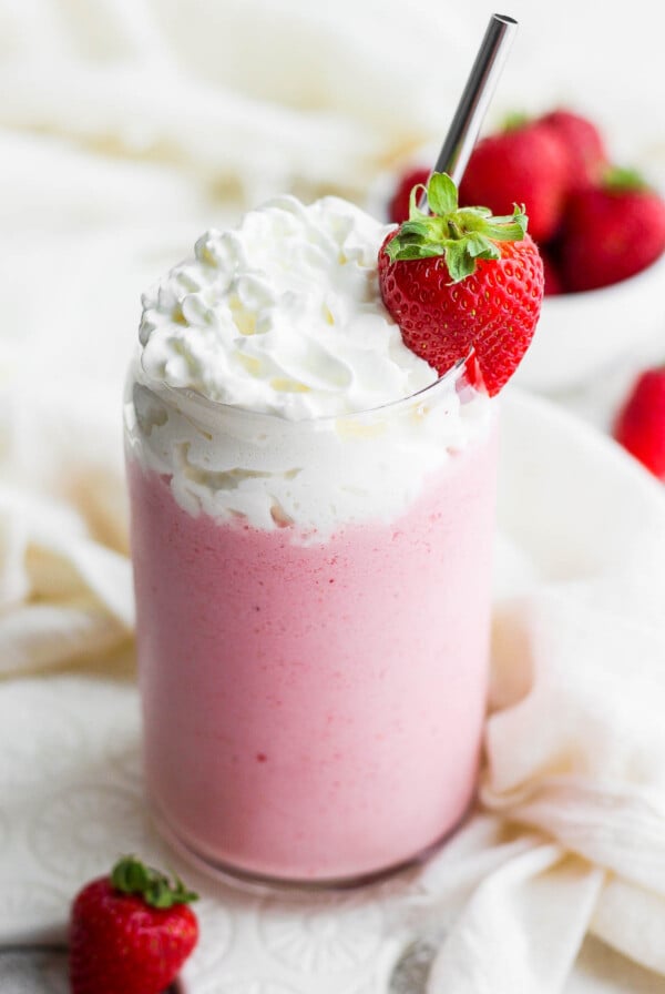 Strawberry shake topped with whipped cream.