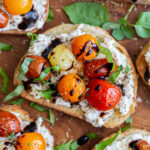 toast topped with ricotta, blistered tomatoes and basil