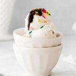 Vegan Ice Cream topped with sprinkles and chocolate fudge