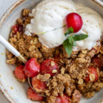 cherry crisp served with vanilla ice cream