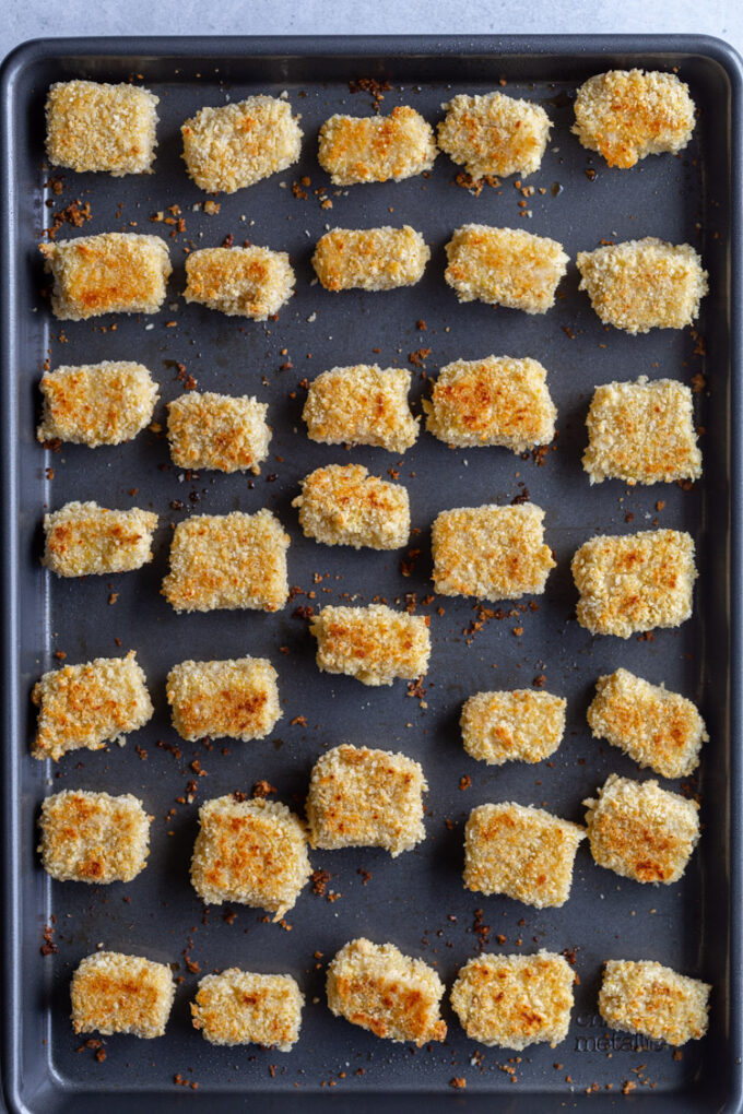 crispy tofu lined up on a baking sheet