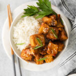 Air Fryer Spicy Tofu served with rice in a small bowl
