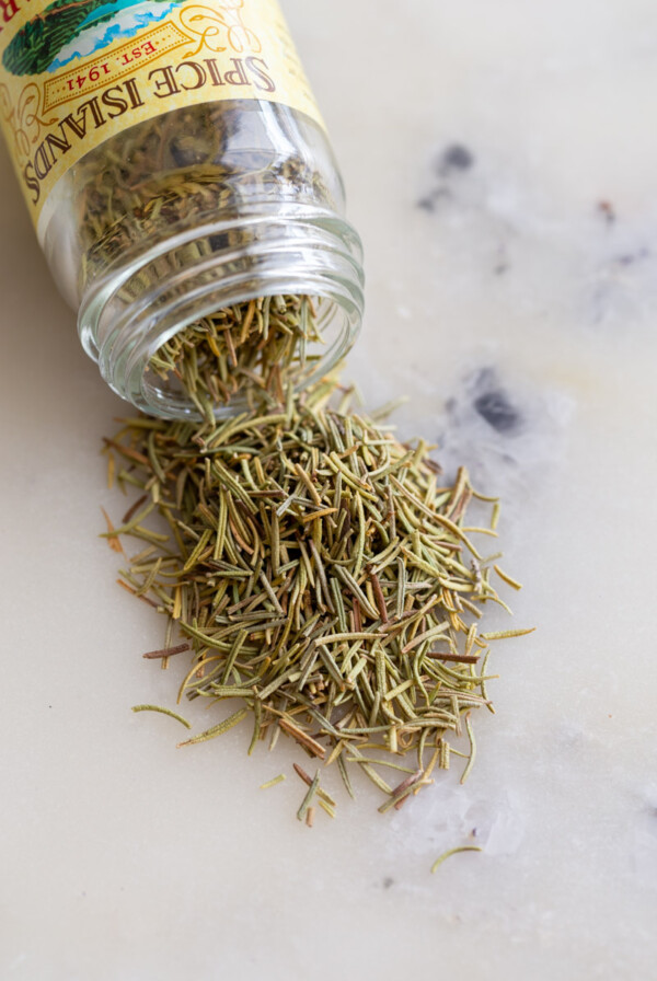 jar of spilled dried rosemary