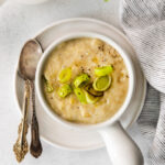 Vegan Potato Leek Soup in a small white soup bowl