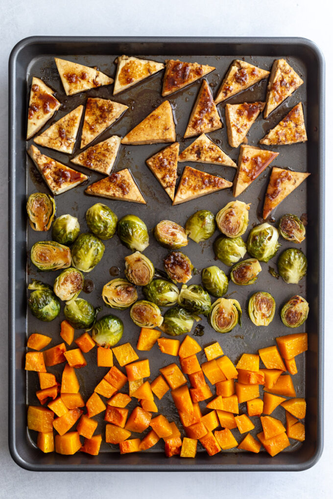 cooked tofu and veggies on a sheet pan