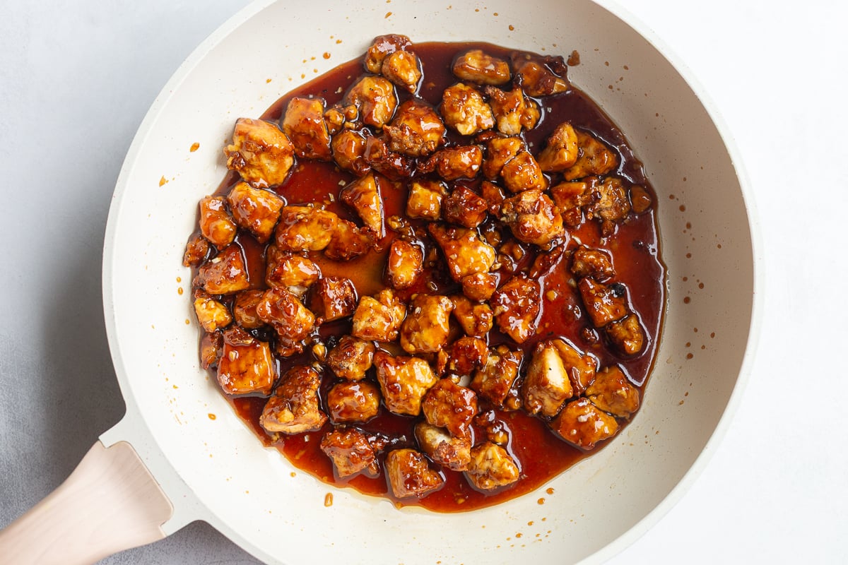 sticky sesame tofu in a large skillet