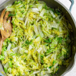 Sautéed Napa cabbage in a large skillet.