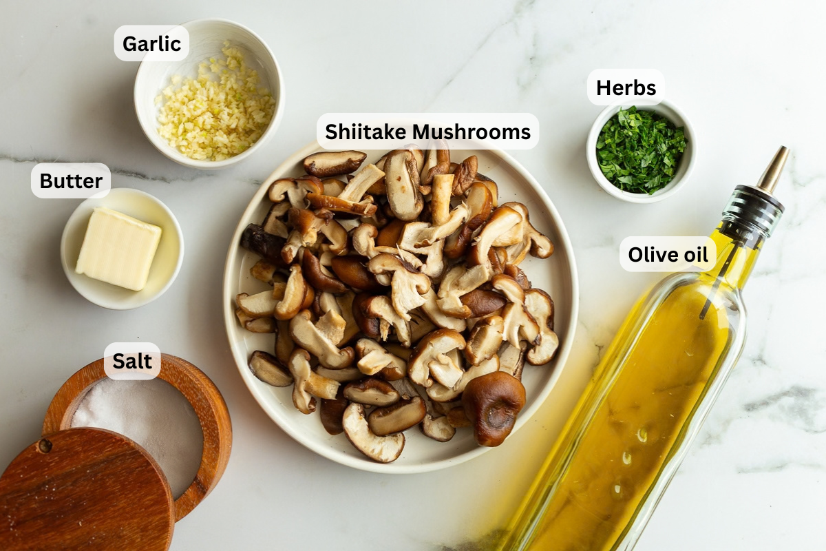 labeled ingredients needed to make shiitake mushrooms including shiitake mushrooms, olive oil, garlic, salt and butter