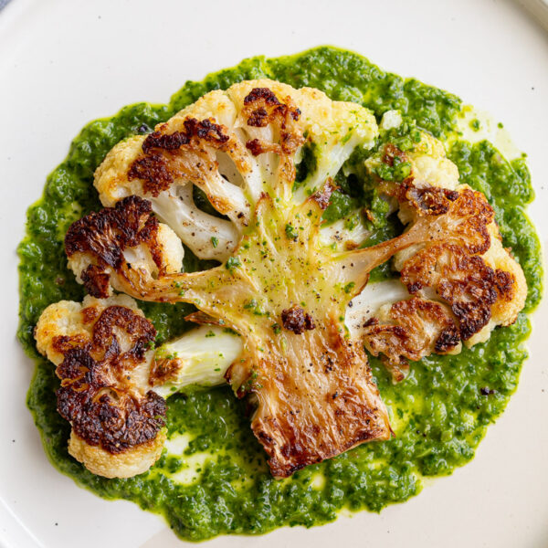 Cauliflower steak served with chimichurri sauce.