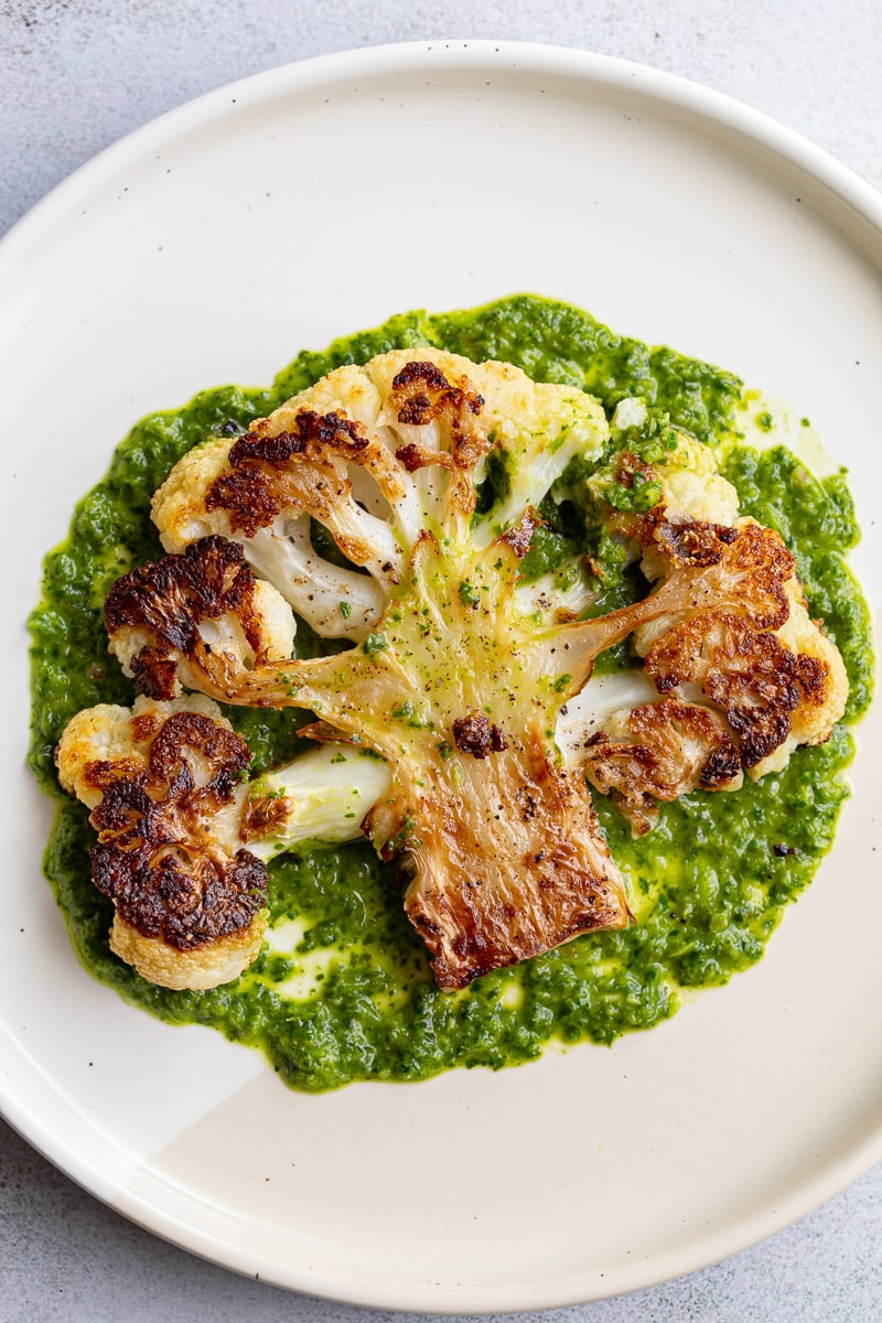 Cauliflower steak served with chimichurri sauce.